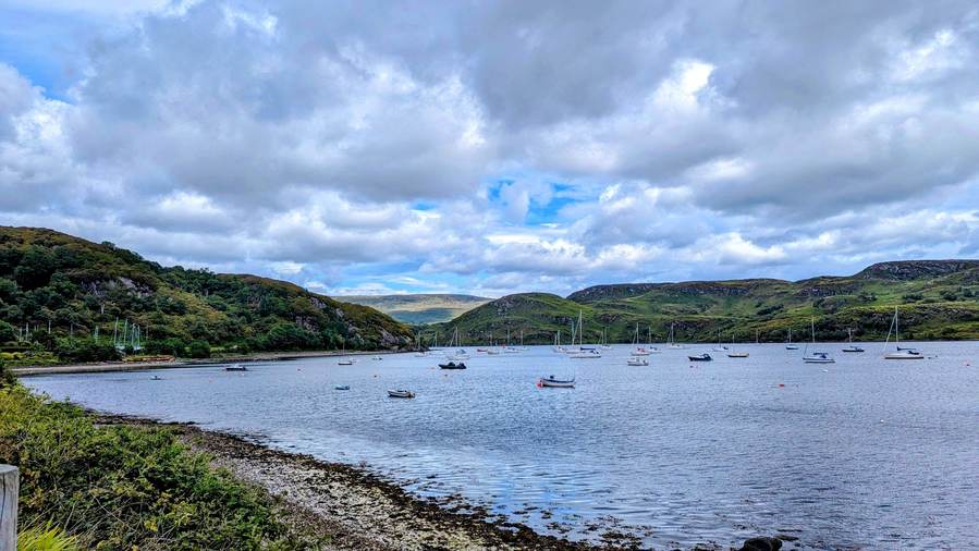 The waterfront at Tighnabruaich with boats moored in the bay