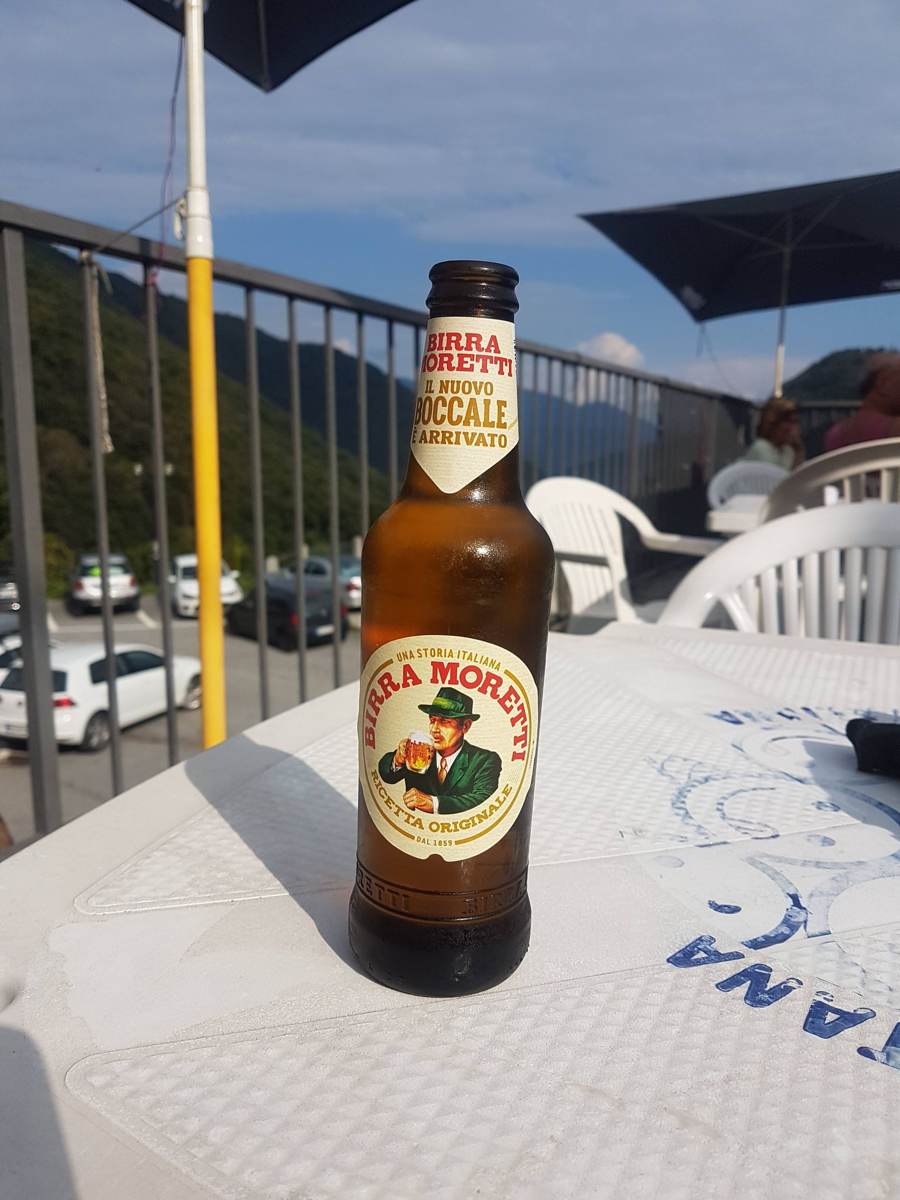 A beer on a café table overlooking the mountains near Cannobio after a ride