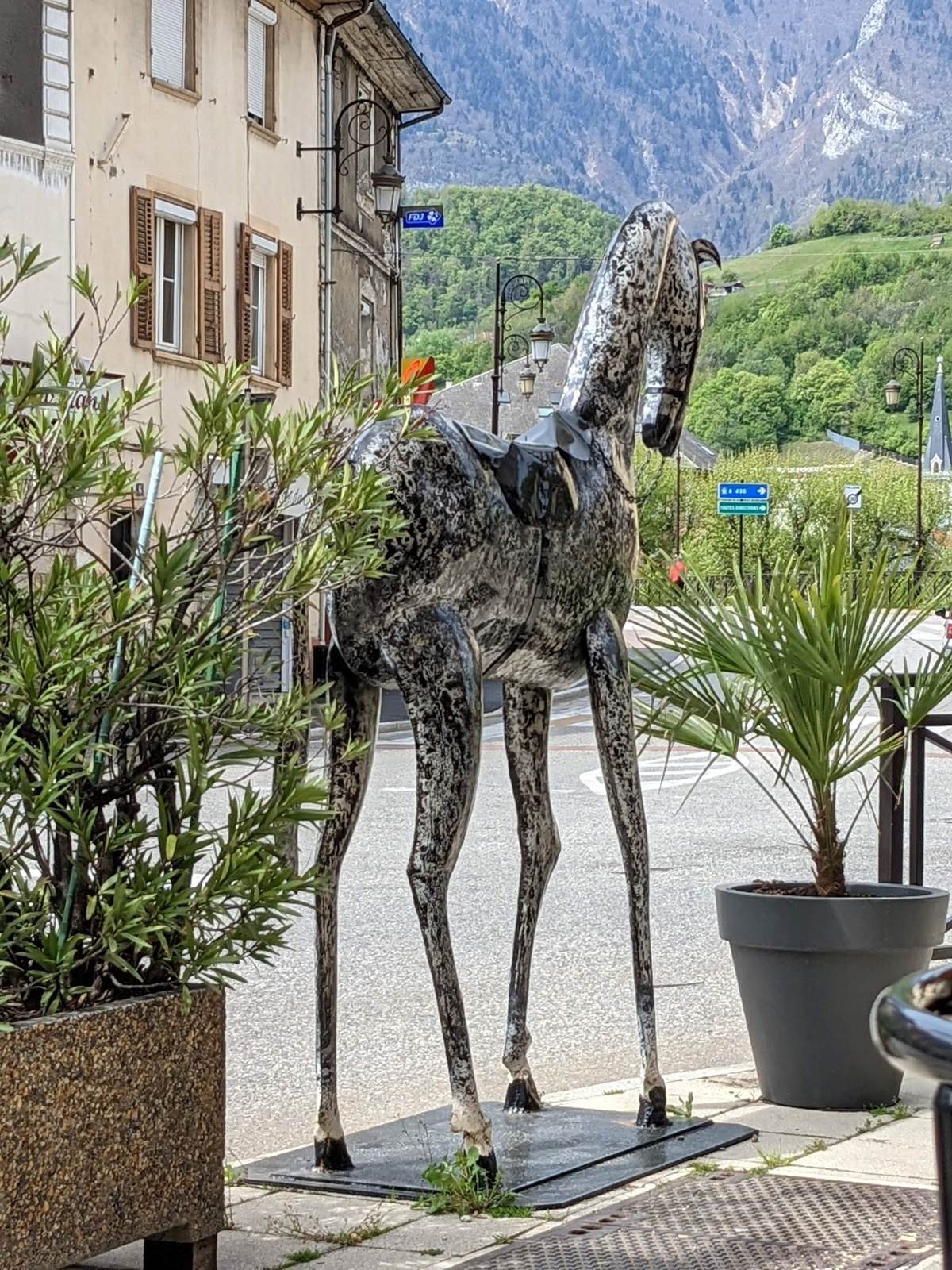 A horse sculpture in a town square in the Beaufortain, French Alps