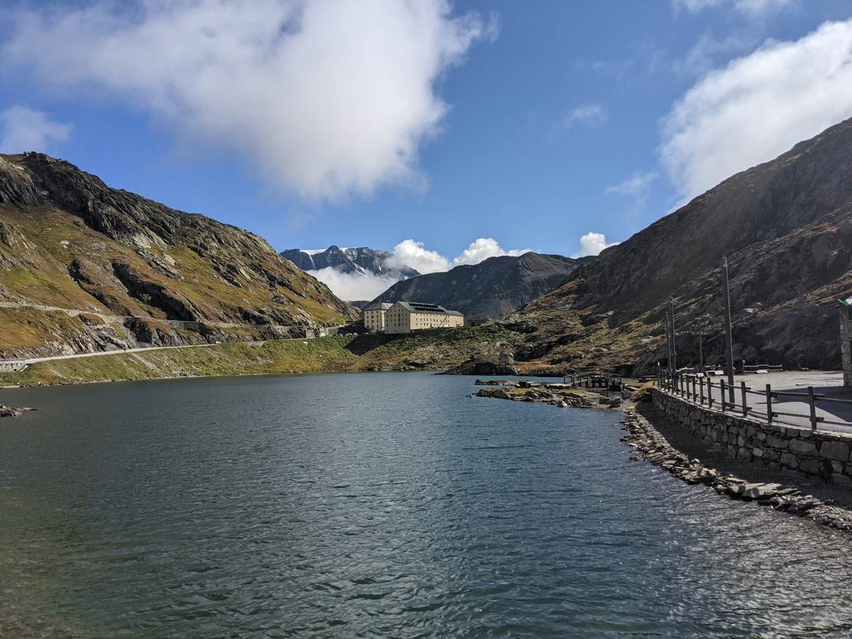 The summit lake at the Grand St Bernard Pass with the hospice beyond
