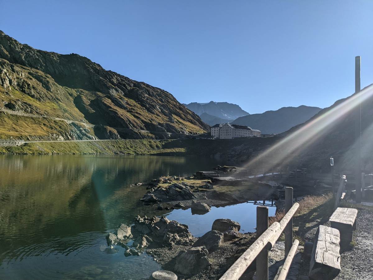 The summit lake and hospice at the Grand St Bernard Pass in early morning sun