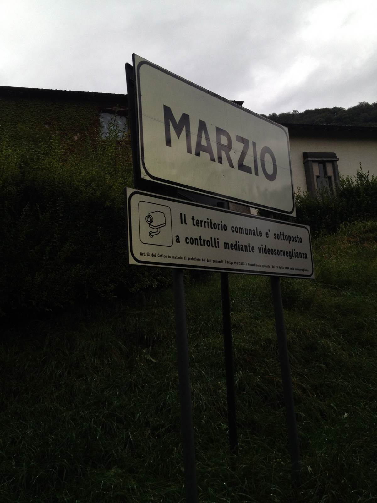 A road sign reading Marzio, a village in the hills above Lake Lugano, Italy
