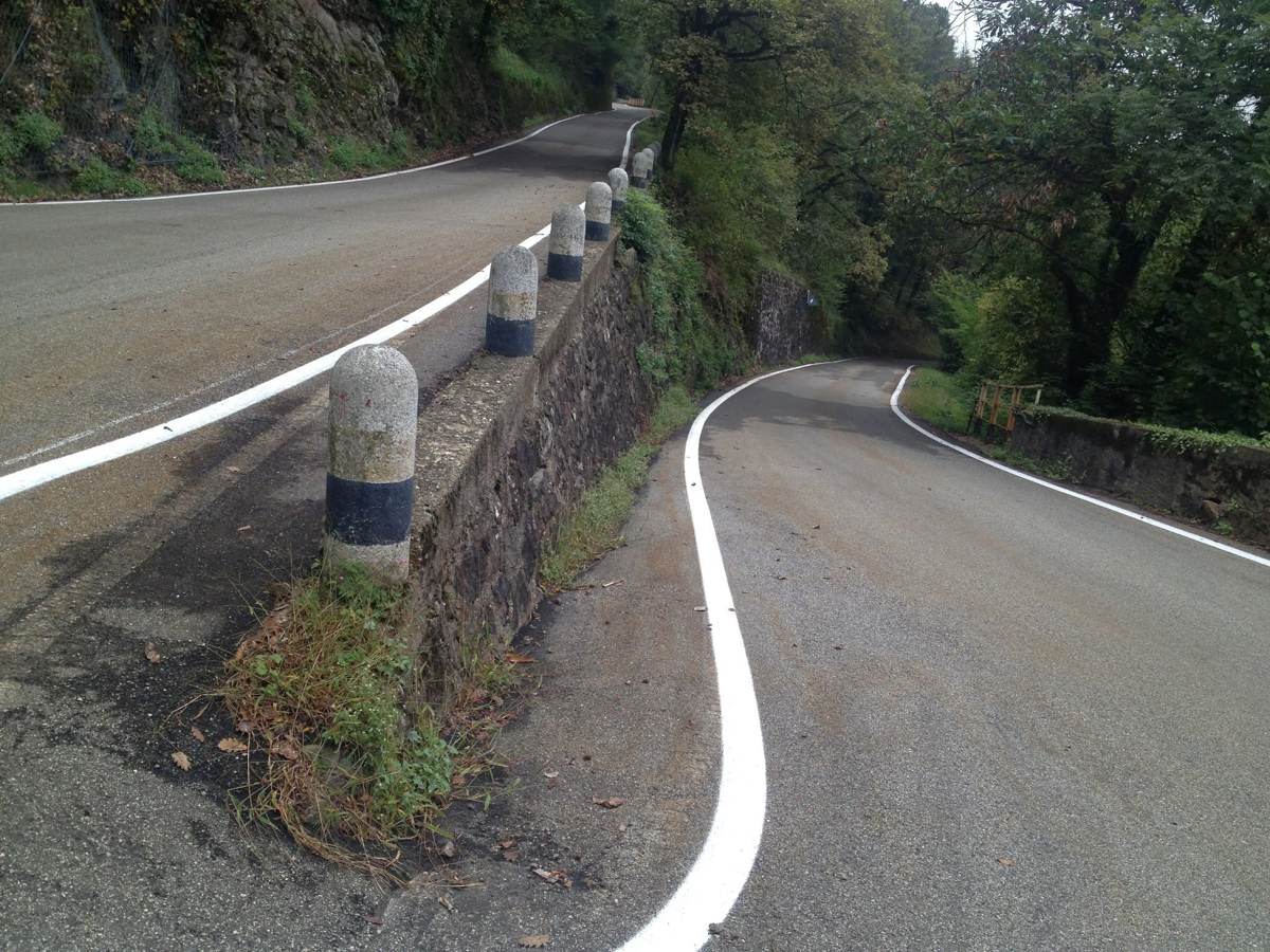 A winding mountain road in the hills above Lake Lugano, Italy