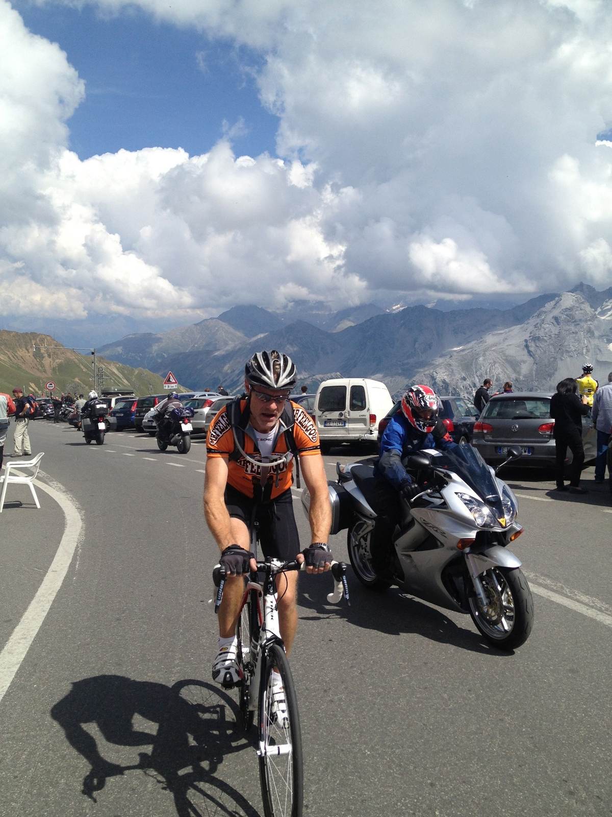 Me riding up the Stelvio Pass with a support motorbike alongside