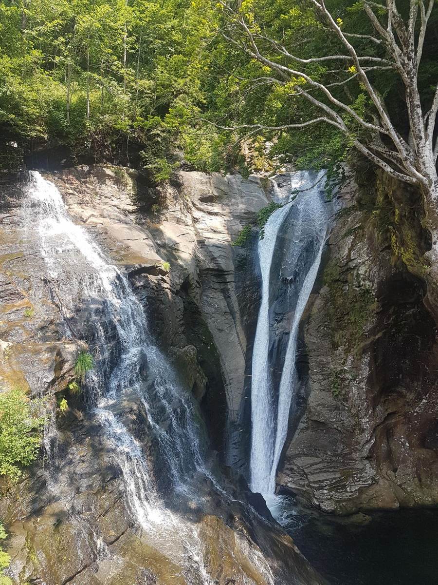 A waterfall dropping through rock into the Verzasca Valley