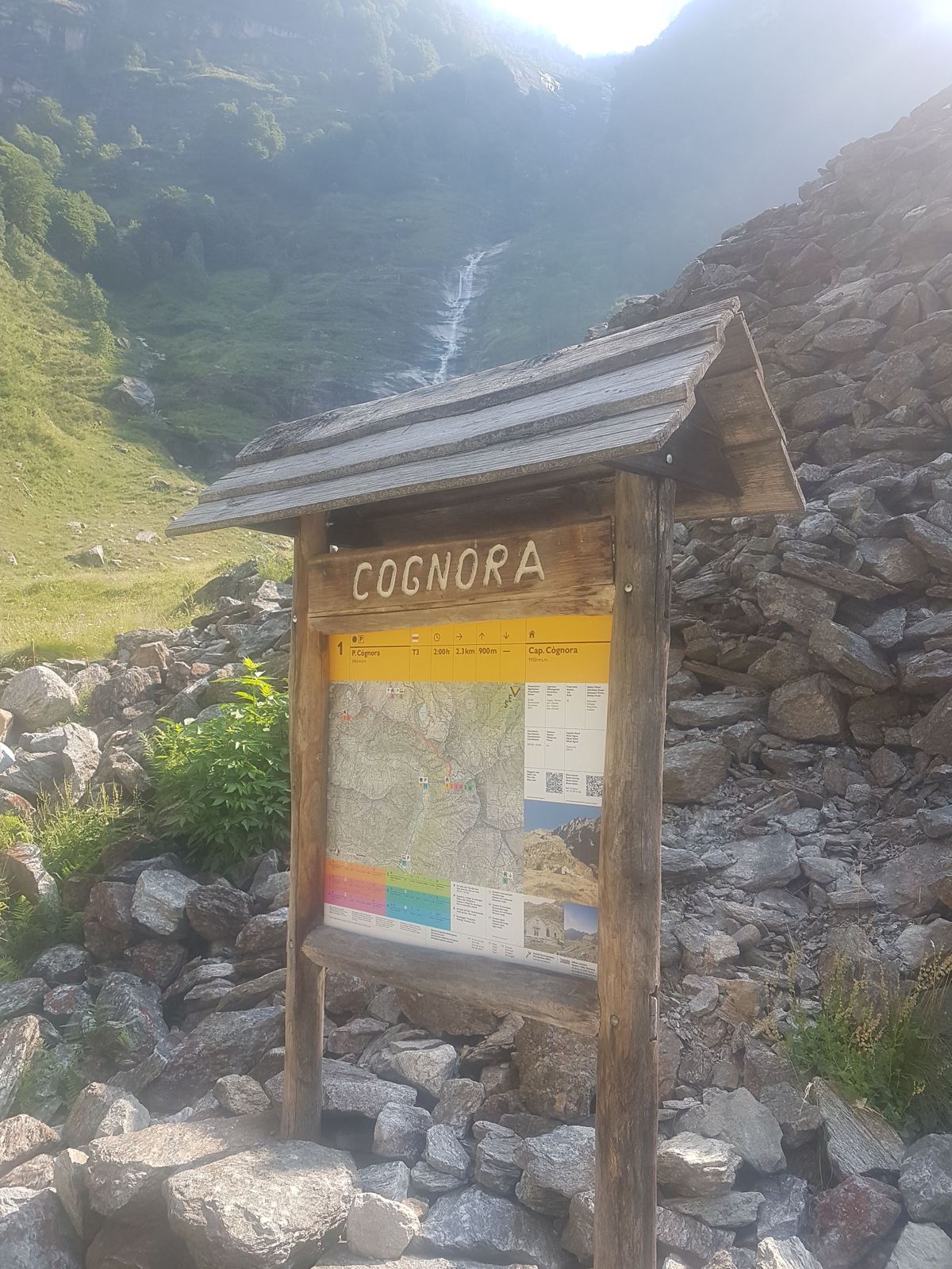 A wooden Cognora trail signpost in the Verzasca Valley above Sonogno